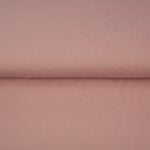 Folded pink cotton fabric texture background