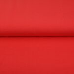 Bright red fabric roll with smooth texture