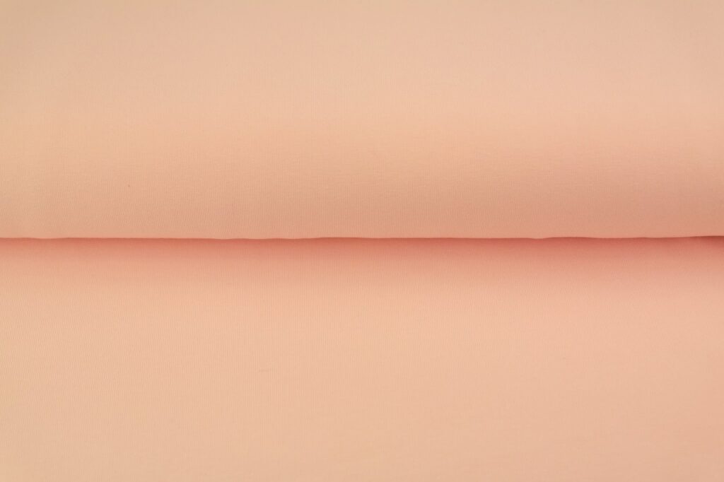 Peach pink cotton fabric material roll