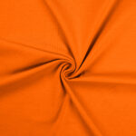 Bright orange fabric twisted into smooth folds