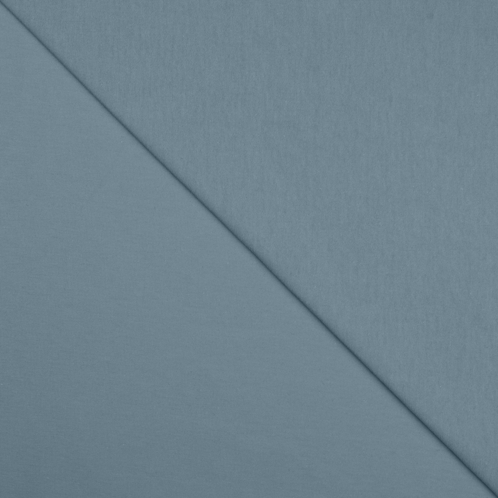 Folded blue fabric with diagonal seam pattern