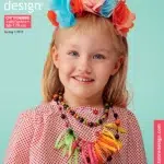 Laps värvilise lillepärjaga Ottobre kaanel