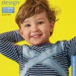 Naeratav laps sinises triiksärgis kollasel taustal