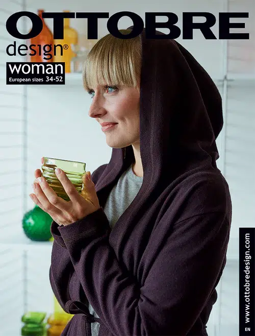 Naine kapuutsiga jopega hoiab rohelist tassi