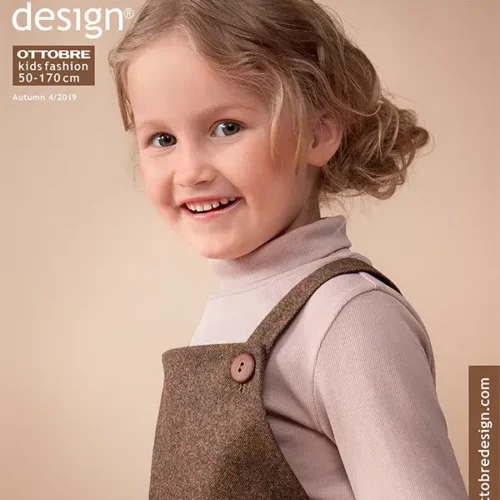 Naeratav laps sügisese moeajakirja kaanel