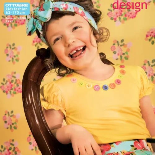 Naeratav laps lillelises suverõivas ajakirja kaanel