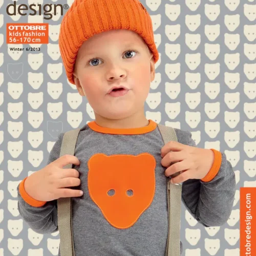 Laps oranži mütsi ja karukujuga särgiga