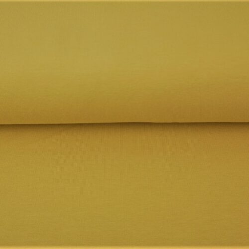 Kollane puuvillane kangas rullis