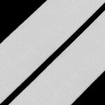 Valge elastne riba mustal taustal