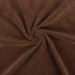 Pruun pehmea kangas keeratud voldiks