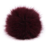 Tumepunane karvane pompon