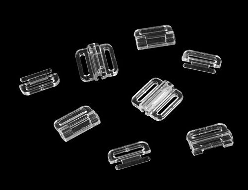 Läbipaistvad plastist rihmaregulaatorid mustal taustal