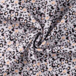 Leopardi mustriga hele kangas