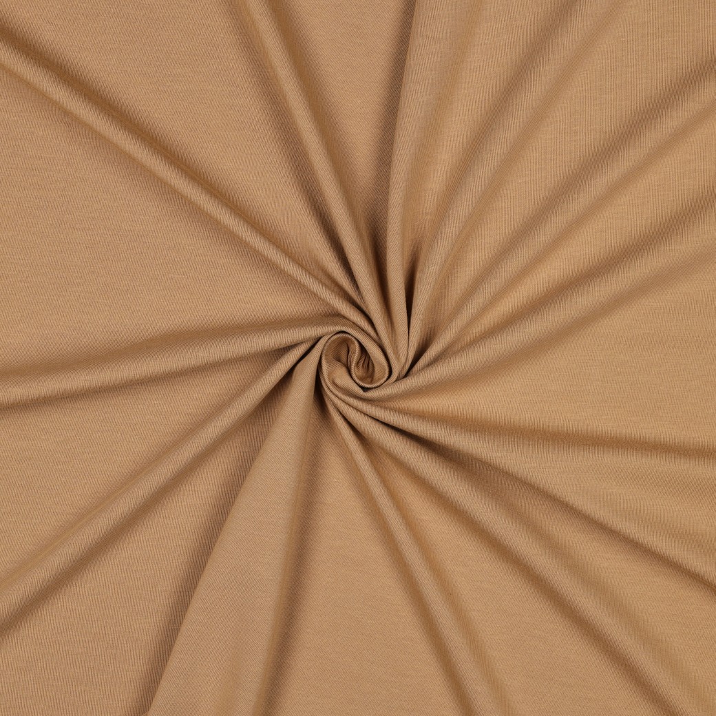 Beež kortsutatud kangas taustana