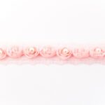 Roosa pitslint pärlite ja lilledega