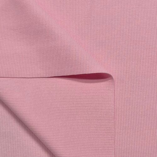 Folded pink ribbed fabric texture close-up