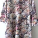 Pastel floral long-sleeve dress on hanger