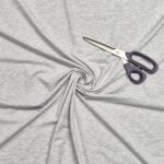 Gray fabric swirl with scissors on top