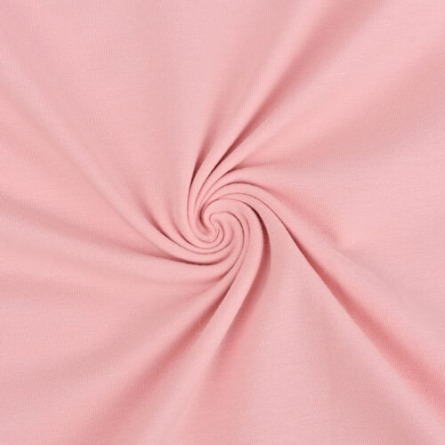 Roosa kangas keeratud spiraalseks mustriks