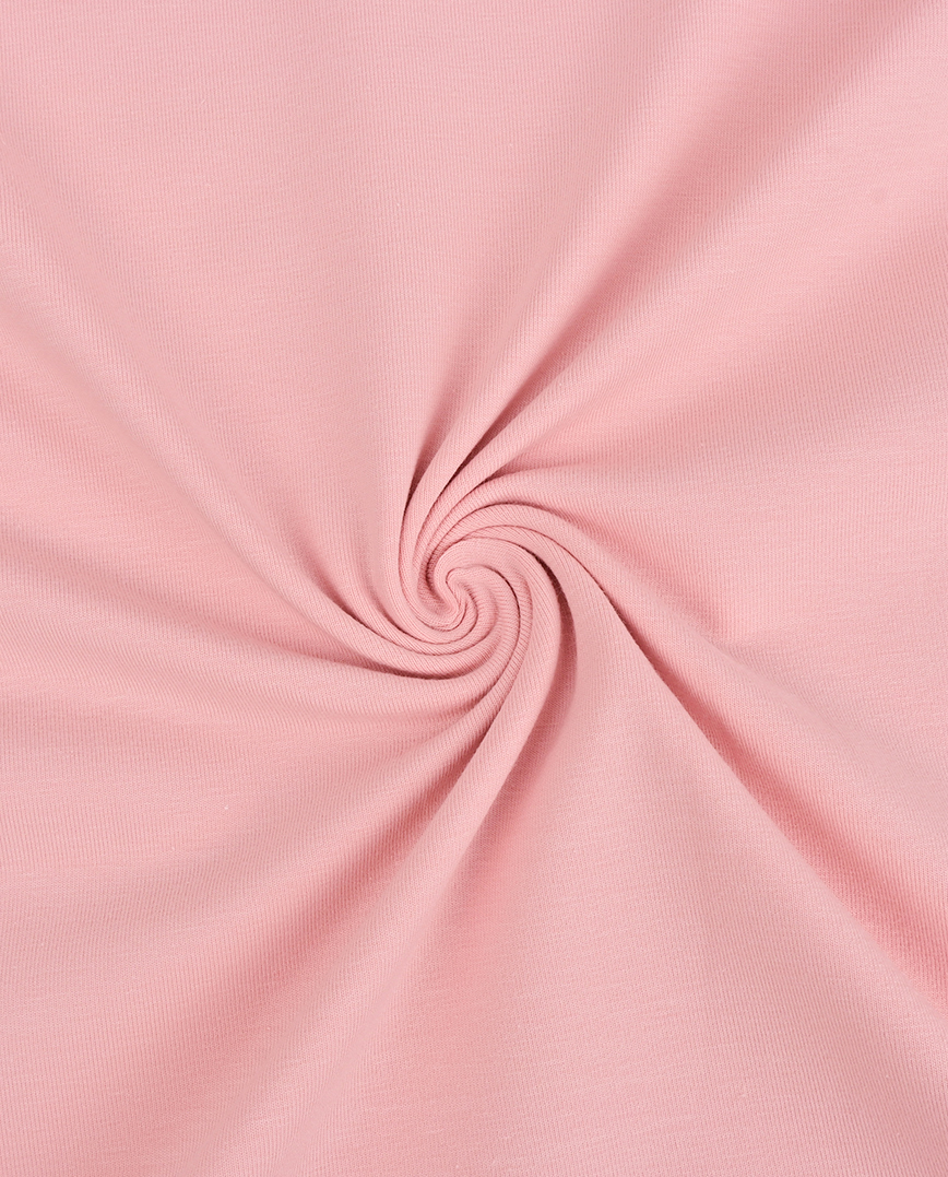 Roosa kangas keeratud spiraalseks mustriks