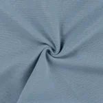 Keeratud helesinine soonikkoes kangas lähivaates