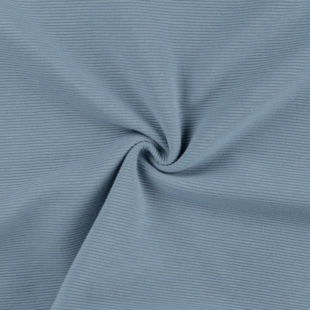 Keeratud helesinine soonikkoes kangas lähivaates