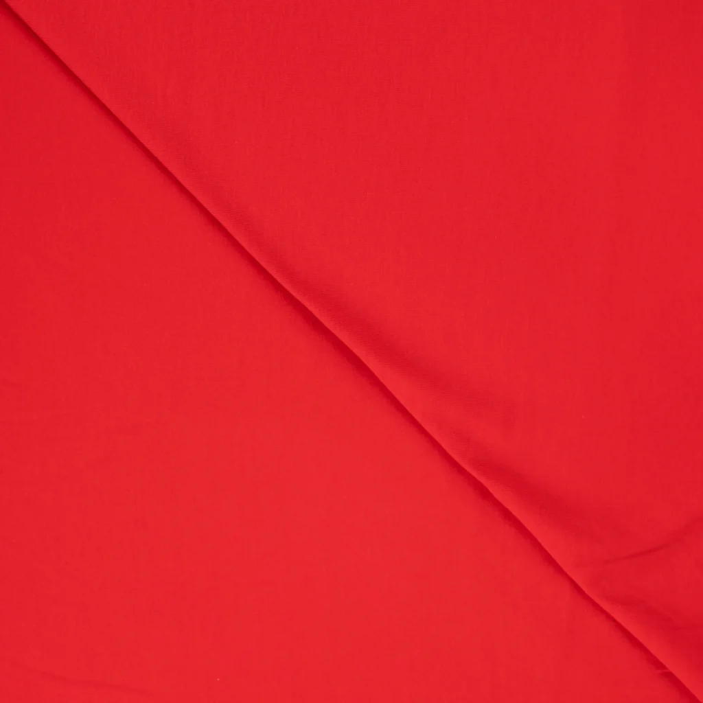 Close-up of red fabric with diagonal fold