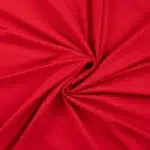 Punane kangas keeratud spiraalikujuliselt keskelt kokku