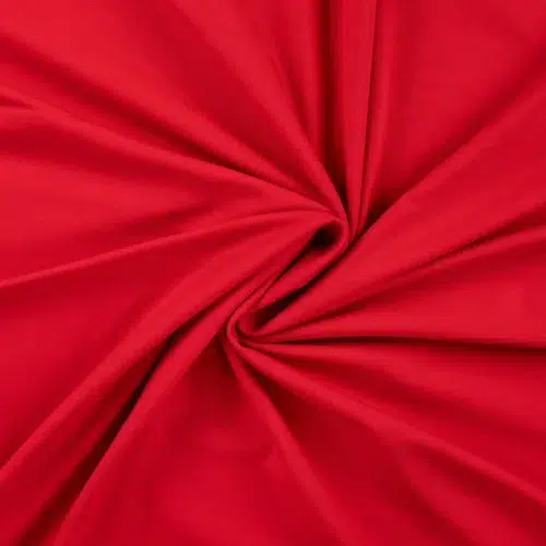 Punane kangas keeratud spiraalikujuliselt keskelt kokku