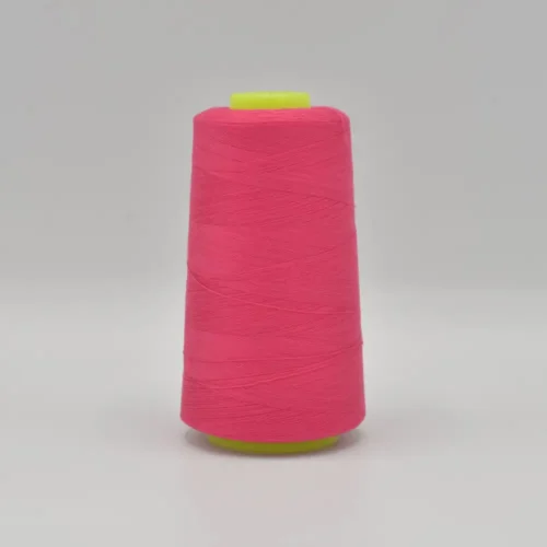 Bright pink thread spool on white background