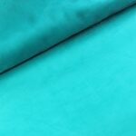 Türkiissinine volditud kangas lähivaates