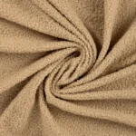 Beež tekstuurne buklee kangas lähivaates